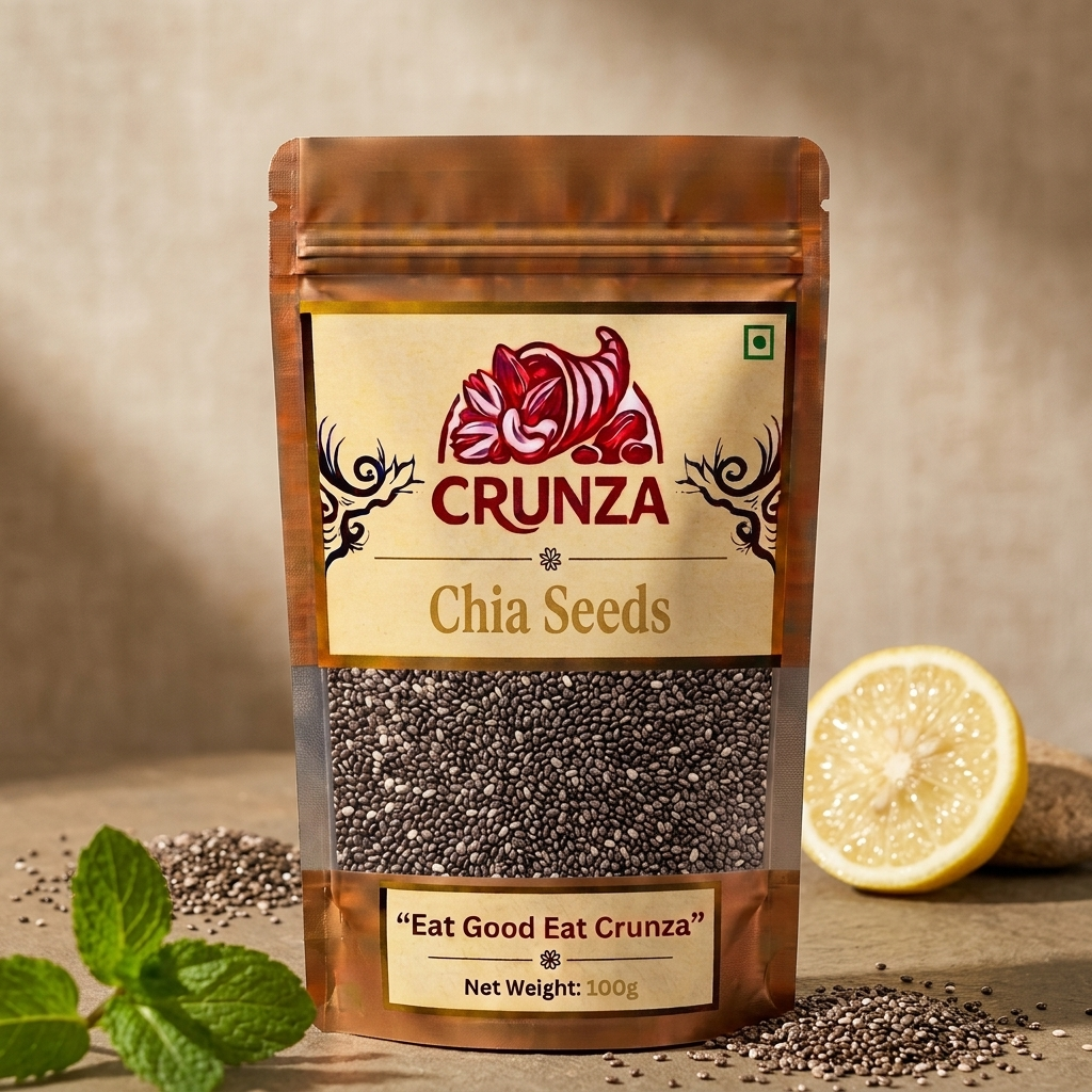 A stand-up pouch of CRUNZA Chia Seeds on a rustic wooden surface with a beige textured backdrop. The pouch is brown with a cream label featuring a red floral logo and the brand name CRUNZA.